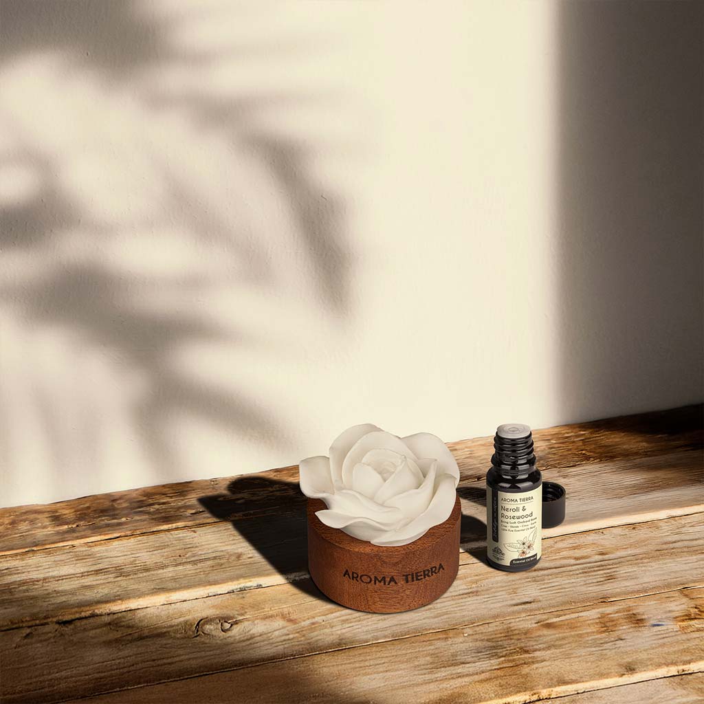 cera flora wood ceramic diffuser with neroli rosewood essential oil blend in a cozy sunlit room
