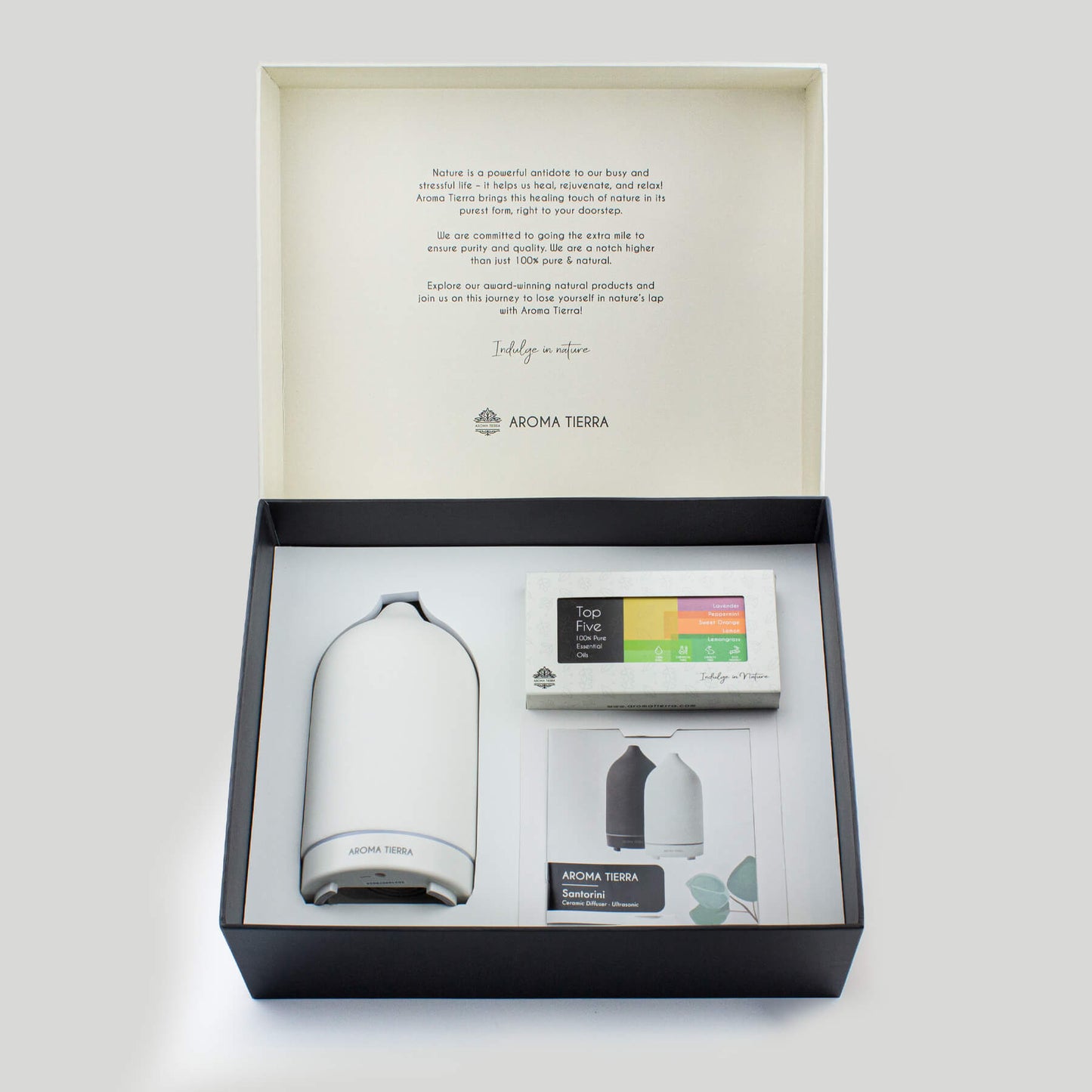 Ceramic diffuser with a set of organic essential oils in elegant packaging, perfect for corporate gifts and wellness-themed giveaways.