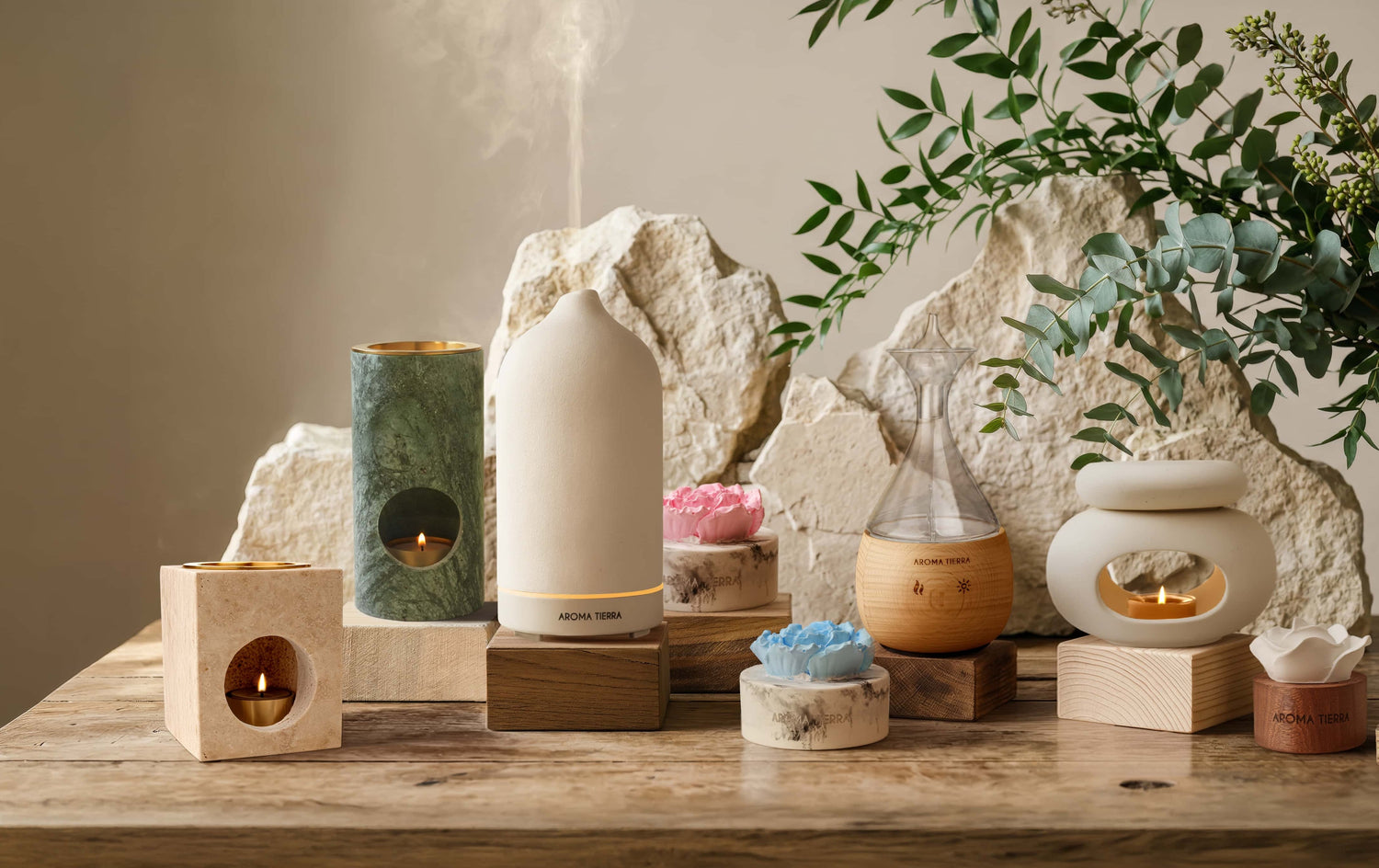 Aroma Tierra diffusers — electric (Santorini), nebulizer (Eternal), burners (Odyssey, Eden), passive (Cera Flora)