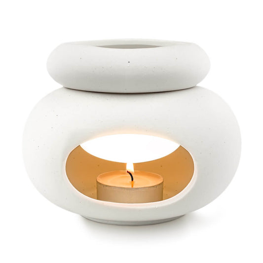 Aroma Tierra Lona ceramic essential oil candle burner — front view with lit tea-light, white background