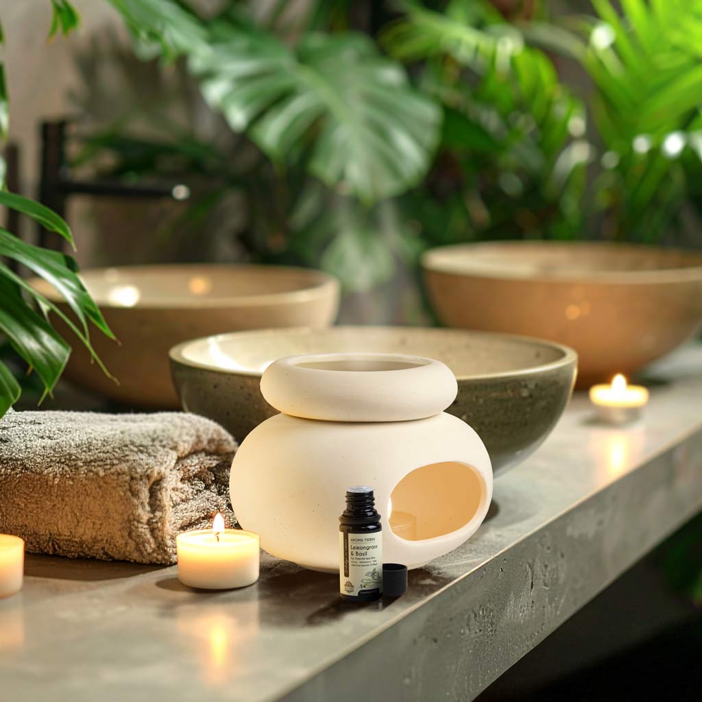 Aroma Tierra Lona ceramic candle burner diffuser in spa setting with Lemongrass & Basil essential oil and candles