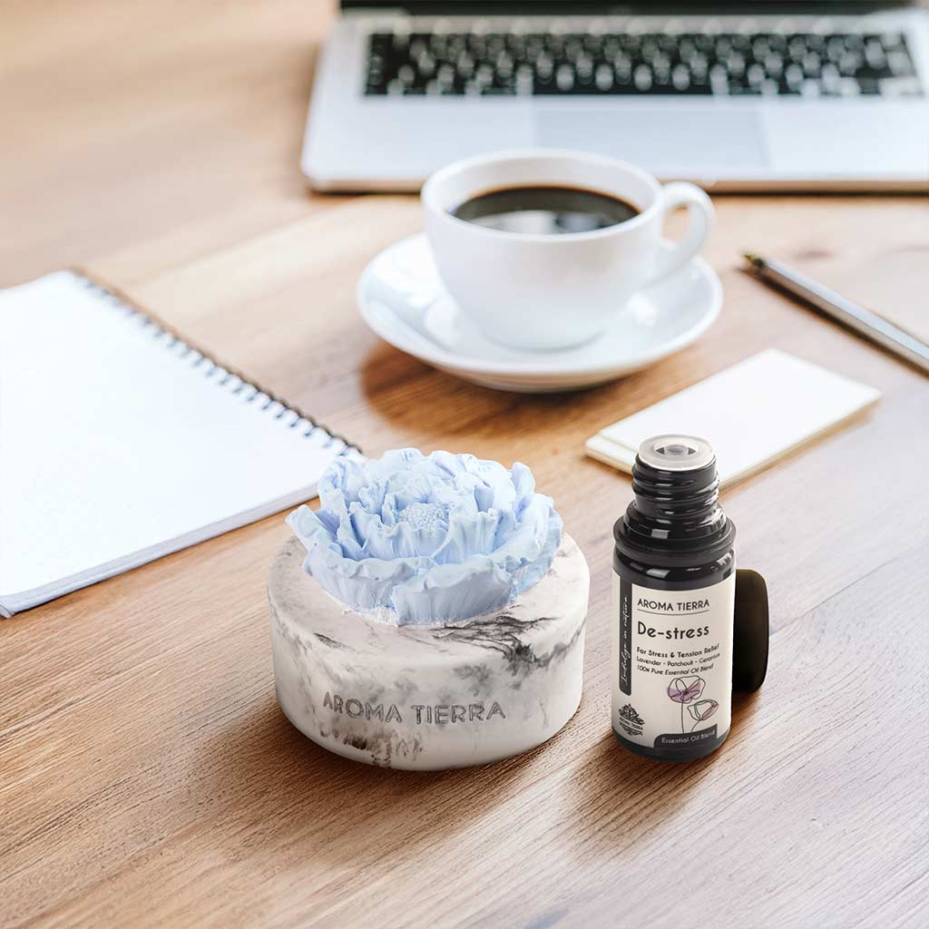 cera flora aroma diffuser with de-stress essential oil on work desk