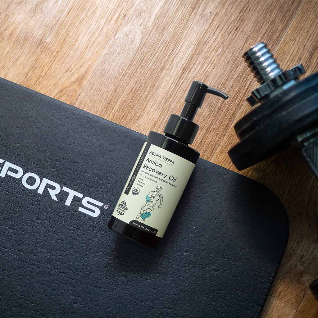 Aroma Tierra Arnica Recovery Oil with soothing aroma for relaxation.