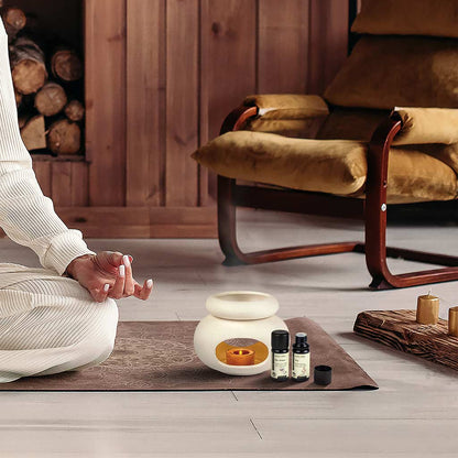 Aroma Tierra Lona ceramic candle burner with De-stress and Joy essential oils during meditation and yoga practice