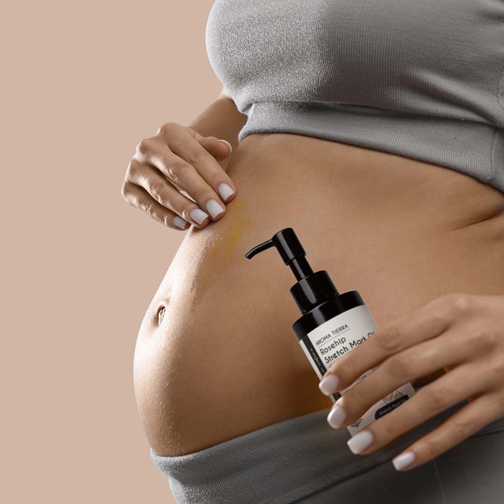 Aroma Tierra Rosehip Stretch Mark Oil with 17 skin repairing botanicals, rosehip, tamanu, pomegranate, almond, avocado, frankincense, myrrh